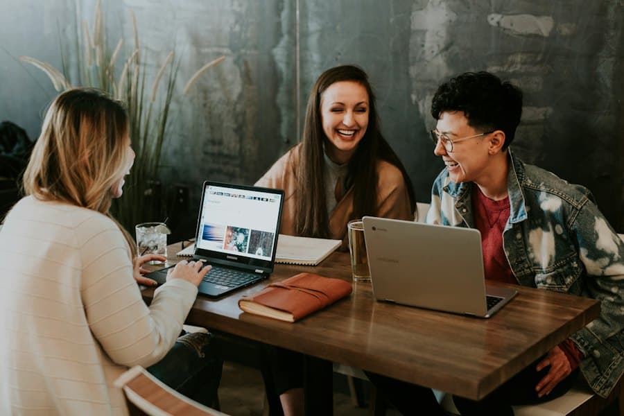 Working professionals studying together on laptops